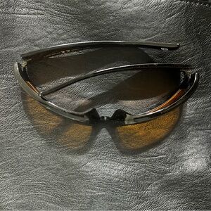 black sunglasses with orange lenses